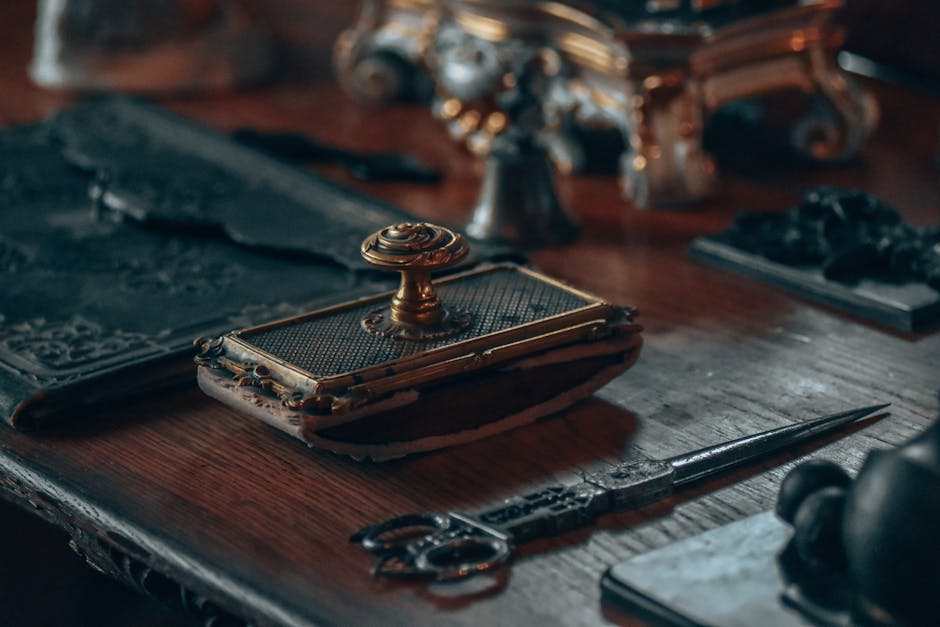 A close-up of a vintage desk with intricate antique objects, offering a nostalgic vibe.